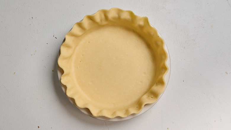 dough pressed into a pie dish