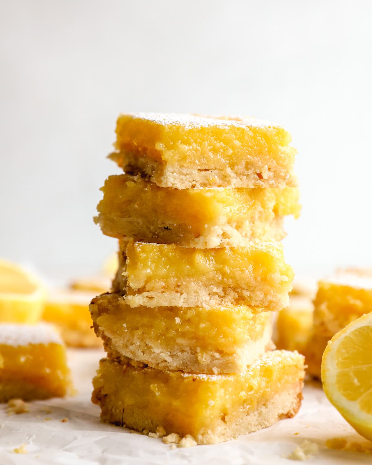 Stack of gluten-free lemon bars with shortbread crust and creamy lemon filling