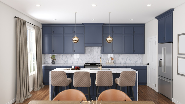A kitchen with navy cabinets