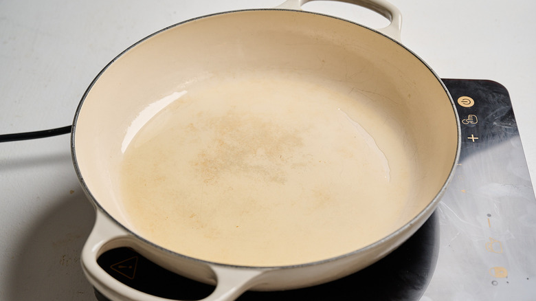 heating oil in a skillet