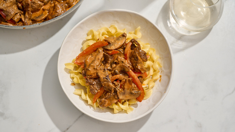 beef stroganoff served over egg noodles