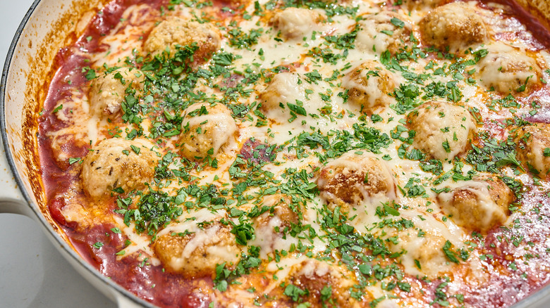 chicken meatballs in tomato sauce in a skillet