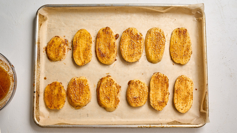 butter brushed onto the potatoes
