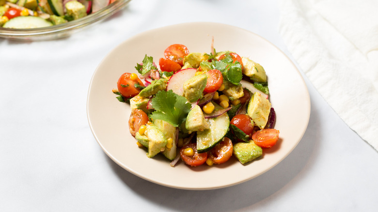 avocado salad served on table