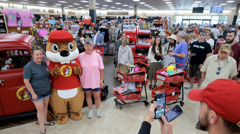 Customers stand in line to take a photo with Buc-ee the beaver