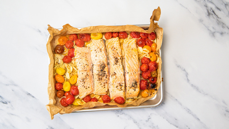 Baked salmon and cherry tomatoes with onion.