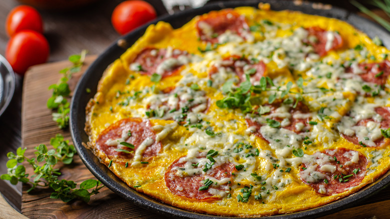 Omelet with toast on white plate
