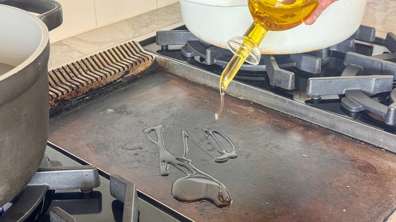 adding oil to grill pan