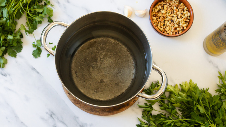 Salted pasta water in pot.