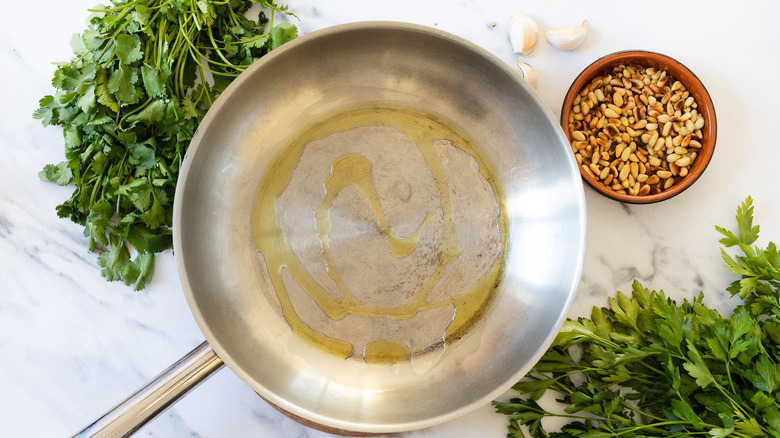 Warm pan with olive oil.