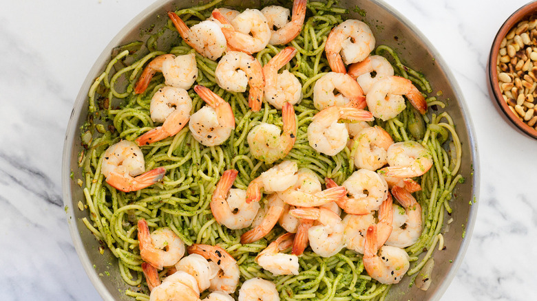Pasta and shrimp in a pan.