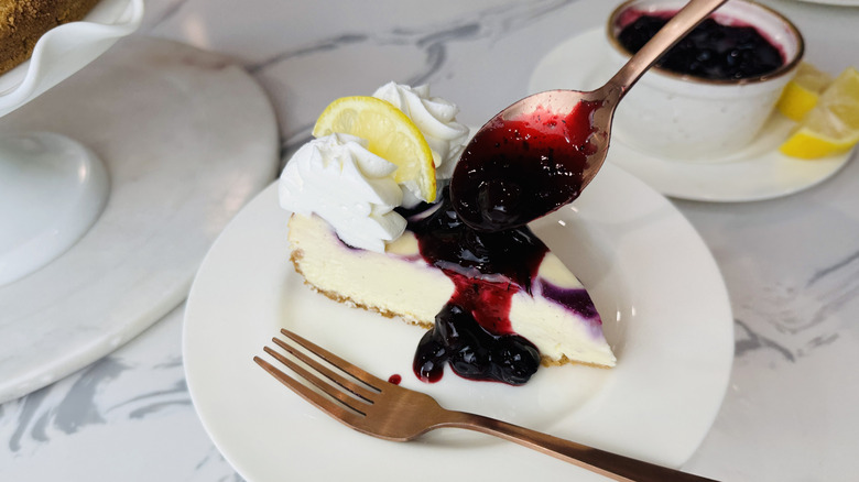 Blueberry lemon cheesecake topped with blueberry topping