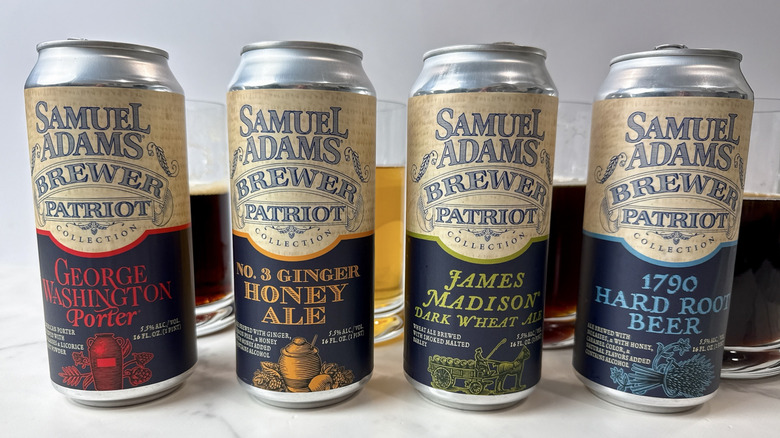 four cans of Sam Adam patriot collection beer with beer mugs behind them
