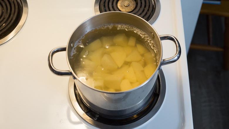 potatoes in pot of water