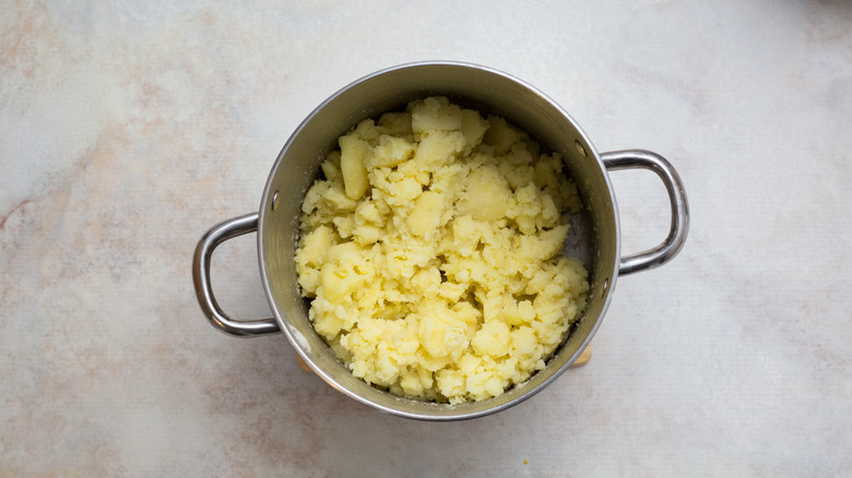 cooked potatoes in medium pot