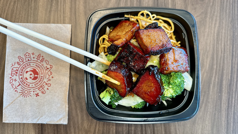 Panda Express Cantonese BBQ Brisket in a bowl with chopsticks
