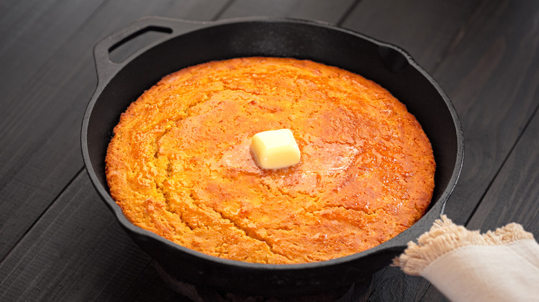 Cornbread with butter in cast iron skillet
