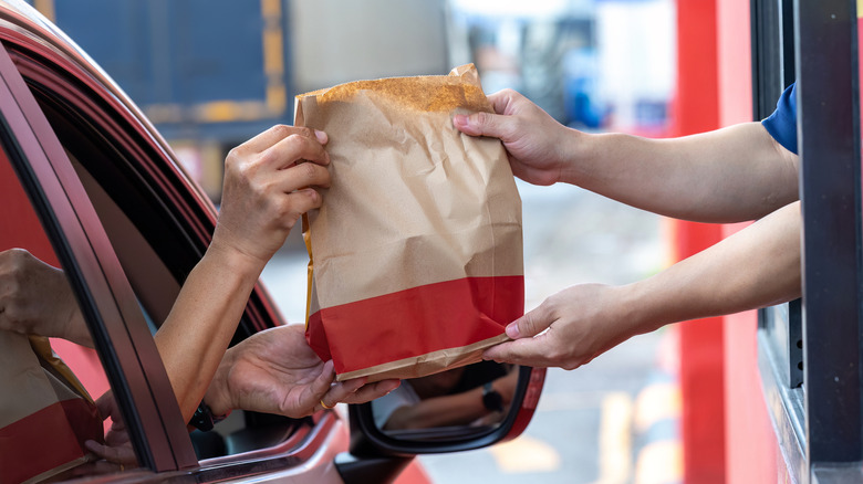 Driver getting takeout bag