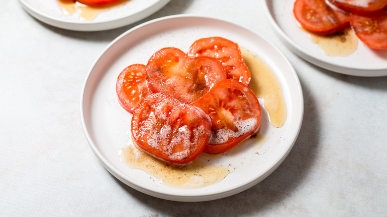 buttery tomatoes served on table