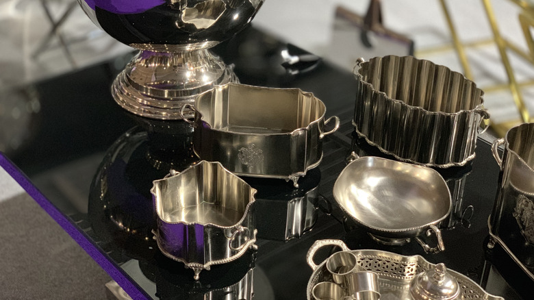 Various silver servingware arranged on a table