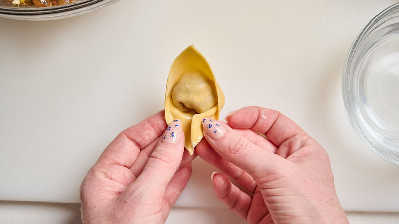 forming a boat shape with the wonton wrapper