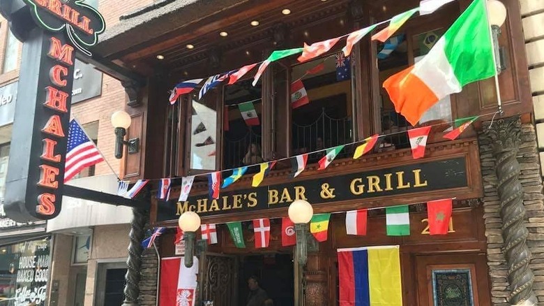 The outside of McHale's bar with flags of the world