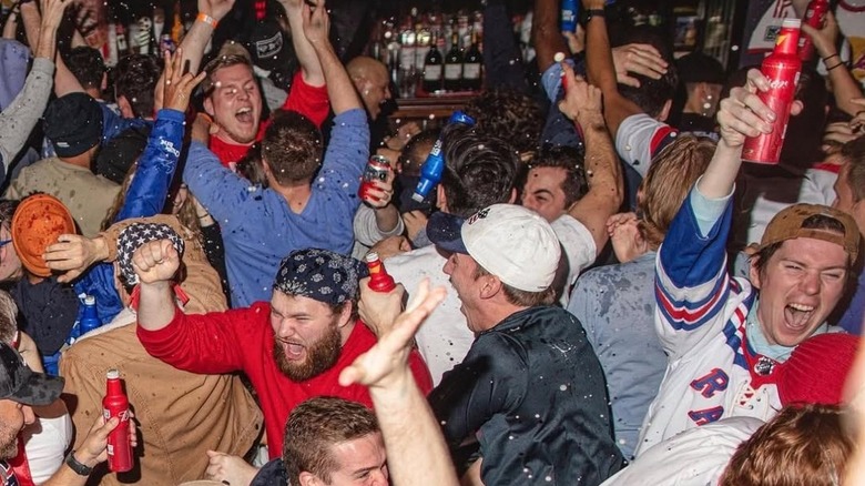 Fans celebrating the game at Football Factory at Legends