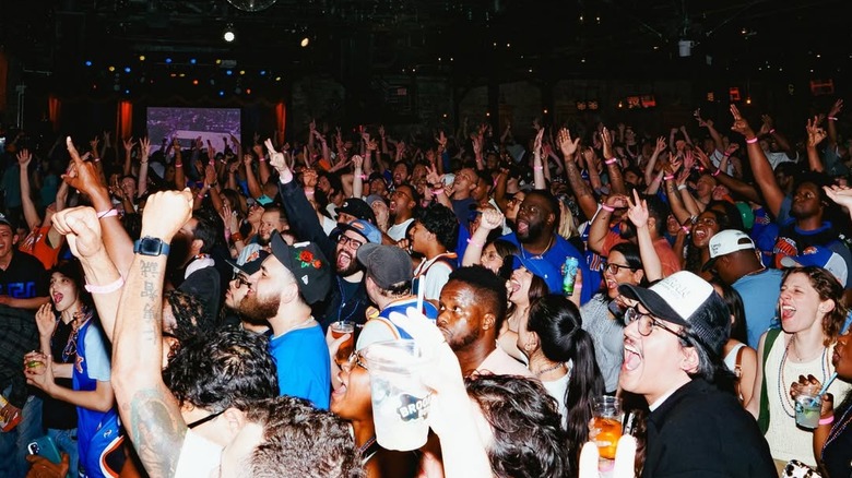 Huge crowd watching a game at Brooklyn Bowl
