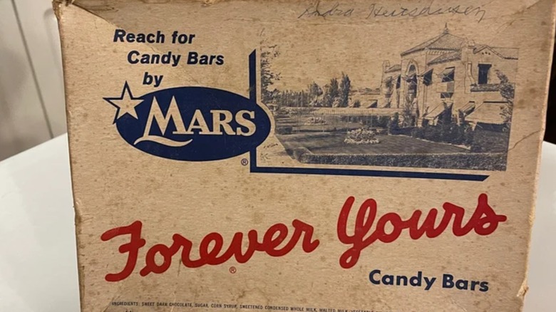 Close up of old vintage box of Forever Yours candy bars from Mars on white table