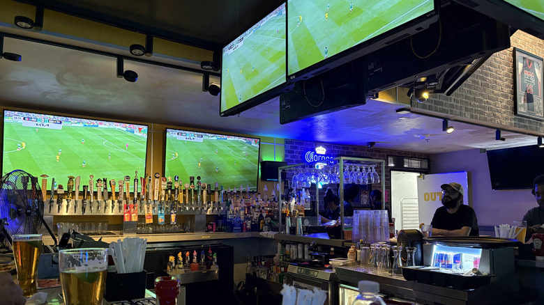 View of a Buffalo Wild Wings bar with a World Cup match playing on several TVs
