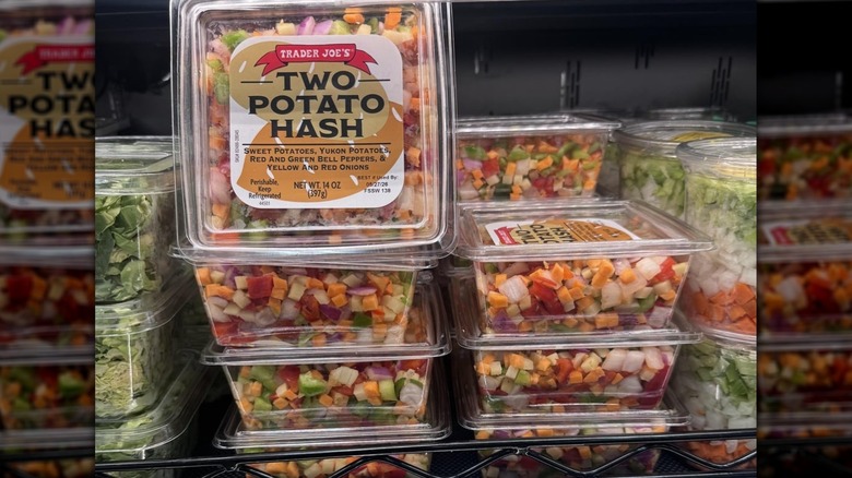 Containers of Trader Joe's Two Potato Hash on display in a store