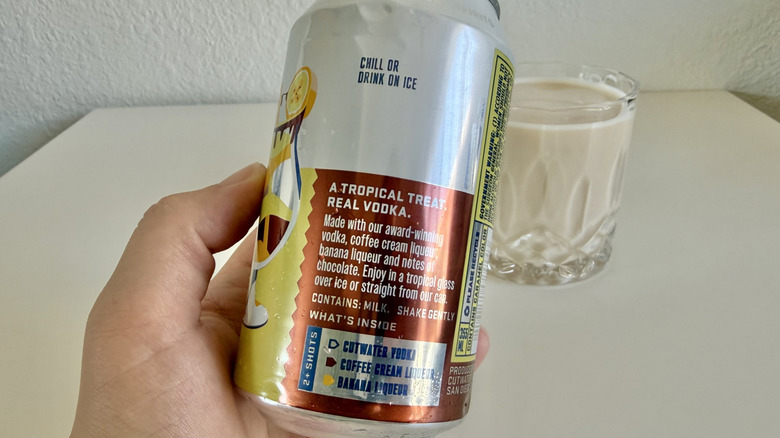 Hand holding empty can of Banana Mudslide