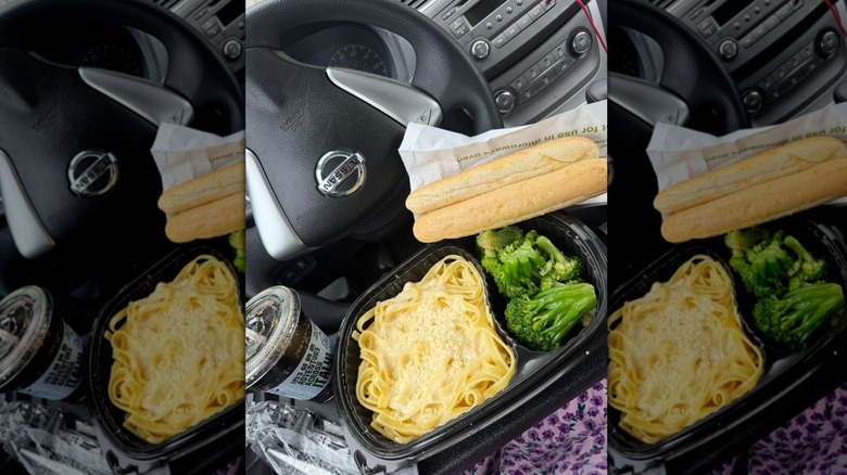 Americanized Italian food from Olive Garden in to-go container in car