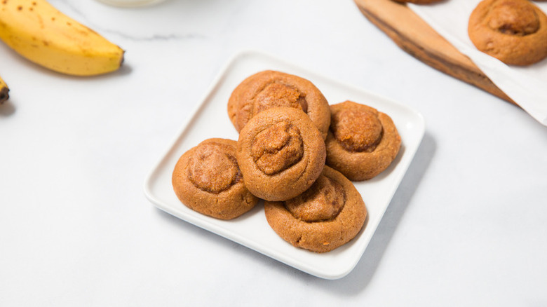 Peanut butter thumbprint cookies on white plate