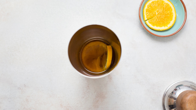 partially made cocktail in shaker