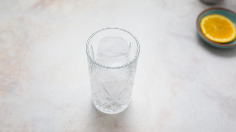 glass with ice on table