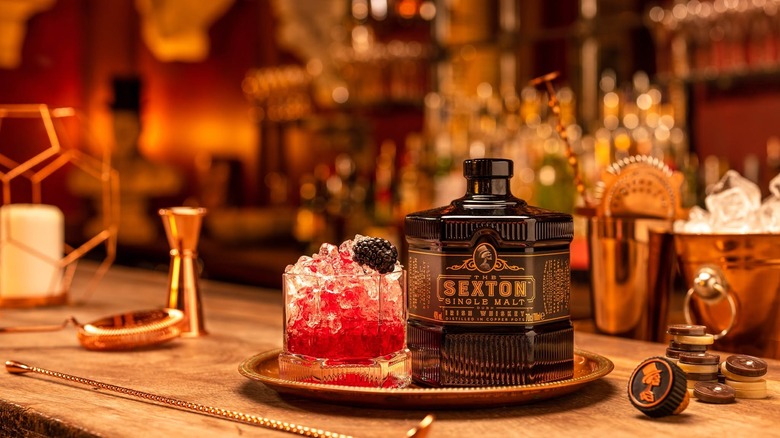 Bottle of Sexton whiskey and cocktail