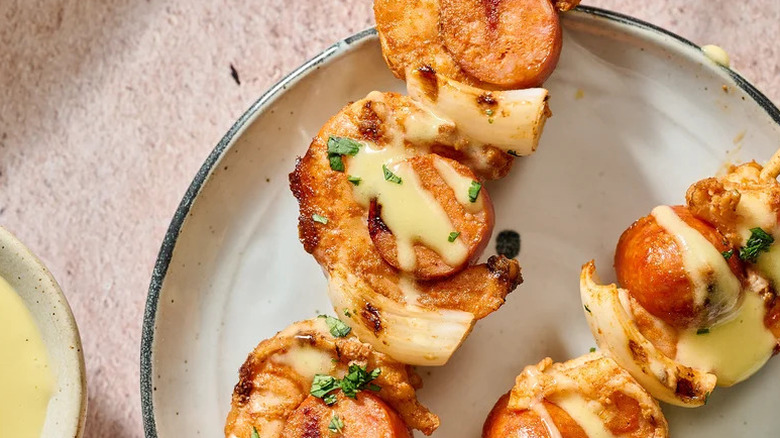 Shrimp and Chorizo Skewers with Lime Aioli on white plate