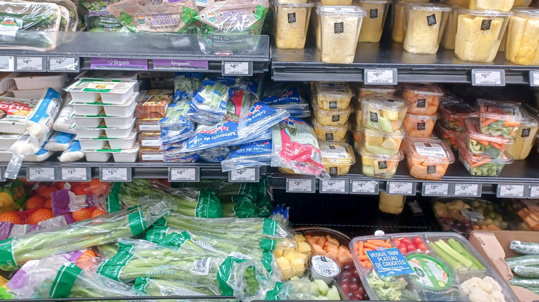 Walmart display of fruits and veggies with plastic packaging