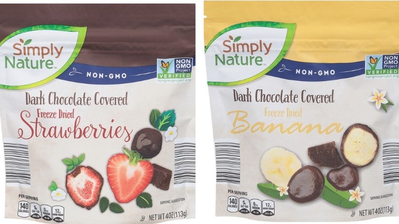 Packages of dark chocolate covered freeze dried strawberries and bananas