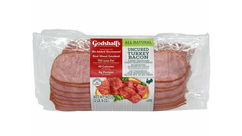 A package of Godshall's Uncured Turkey Bacon on white background