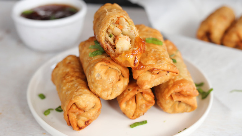 Pile of shrimp egg rolls on plate