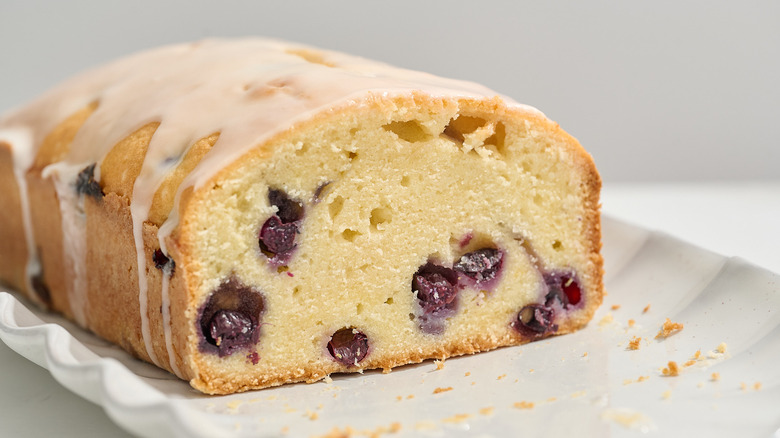 inside of blueberry lemon pound cake shown on a platter