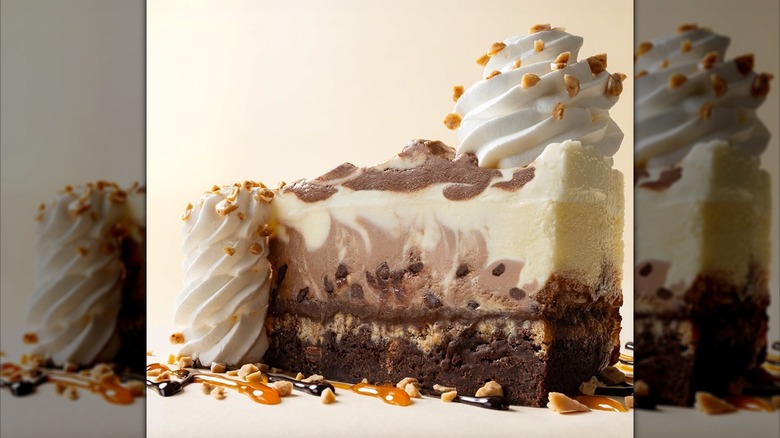 Slice of Cheesecake Factory Brownie Crunch Choc-a-Lot Cheesecake with drizzles of chocolate and caramel sauce