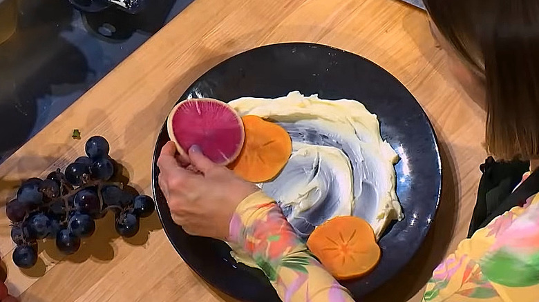 Top view of chef plating fruit and cream on 24 in 24: Last Chef Standing