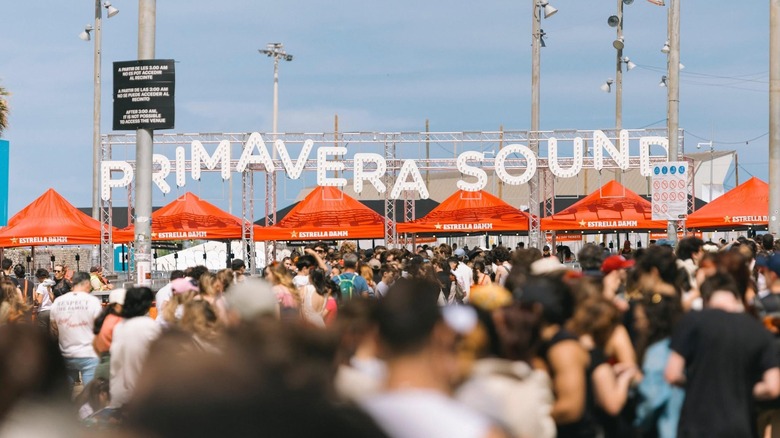A shot of attendees heading in the Primavera Sound under a large sign