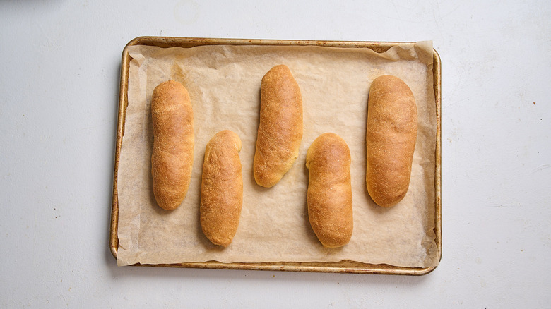 baked hot dog buns on a sheet tray