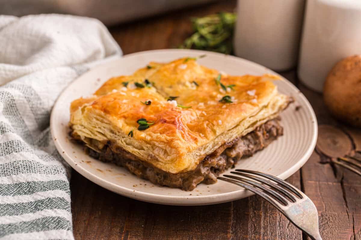 Beef Wellington pot pie bake cut and served on a plate