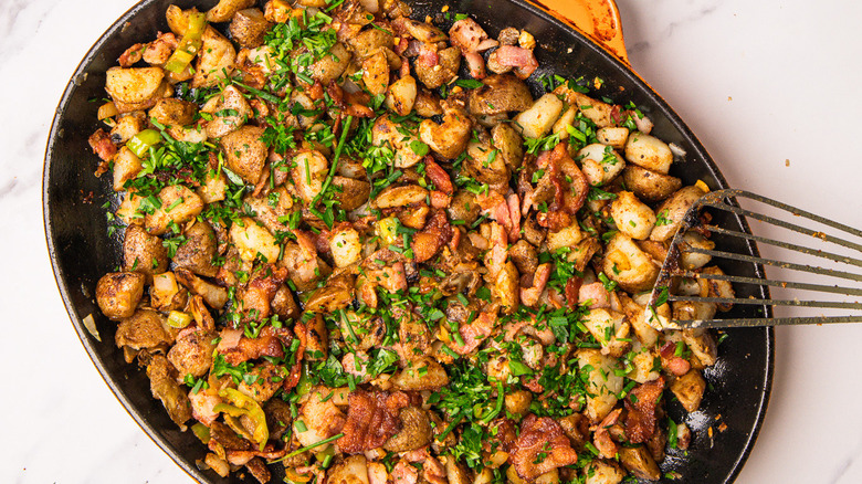 cowboy-style cast iron potatoes with spatula