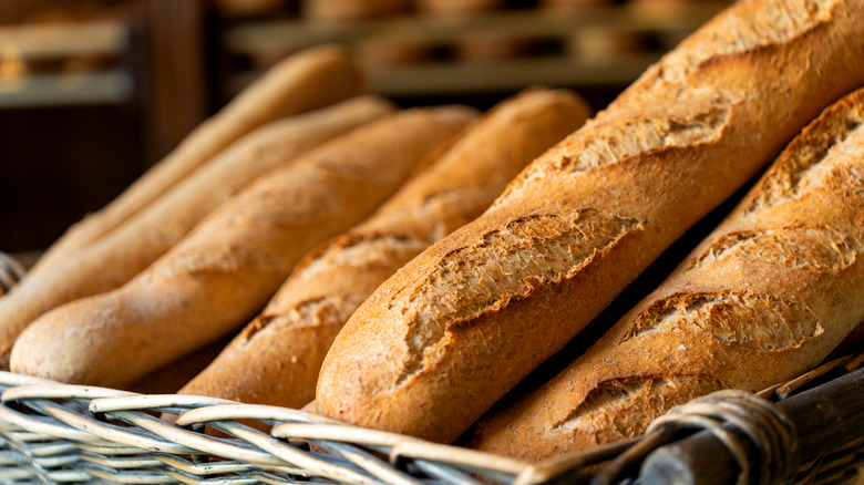 Several French baguettes in a basket